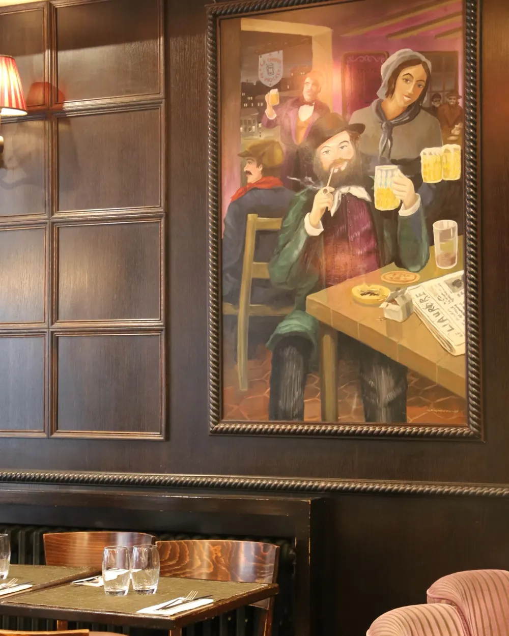 The Via Del Gusto dining room, wood panelling and a large painting